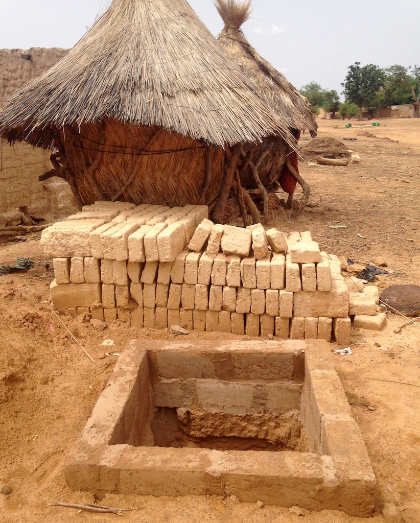 Cement interior border and local mud bricks for latrine enclosure walls