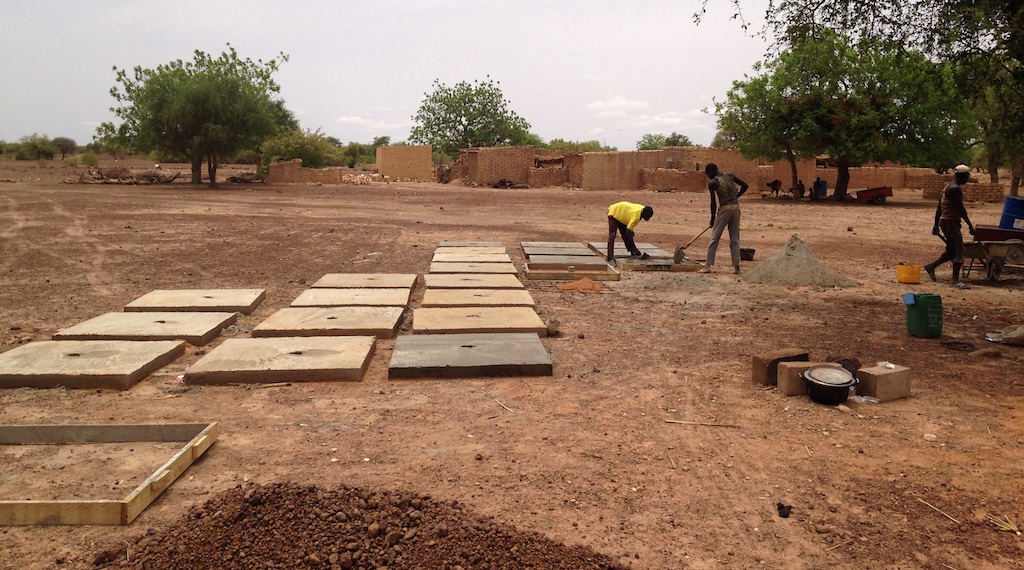 masons building the latrine platforms