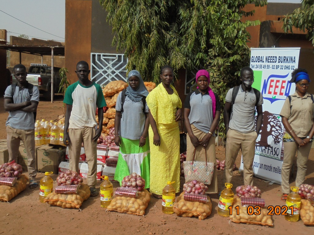 People standing with the distributions of food
