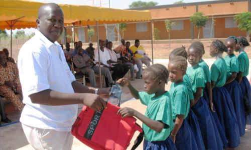 Director of Association NEEED delivering supplies to incoming students.